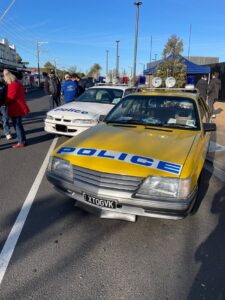 Glen Huntly car show old vintage yellow police car on display