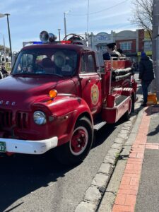 Glen Huntly vintage car show old red fire engine with kids on the back